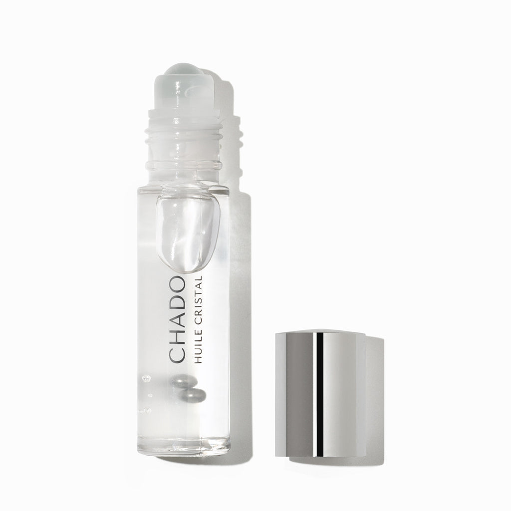 Huile Cristal - Nourishing Brow Oil in an elegant glass bottle, featuring natural ingredients like castor oil for promoting eyebrow growth and enhancing brow health.
