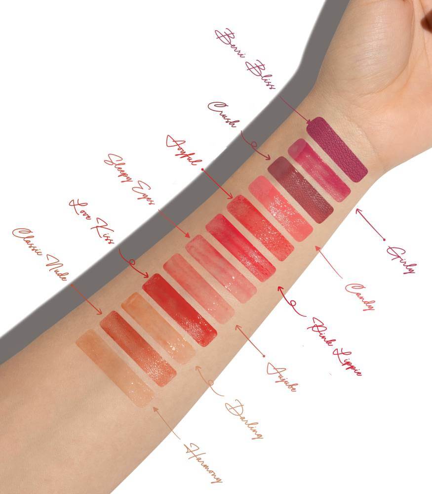 Swatch of Jujube volumizing lip gloss on hand showing its vibrant color.