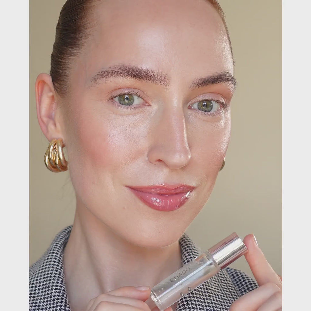 Model applying Huile Cristal - Nourishing Brow Oil, helping to moisturize and condition brows for optimal growth.