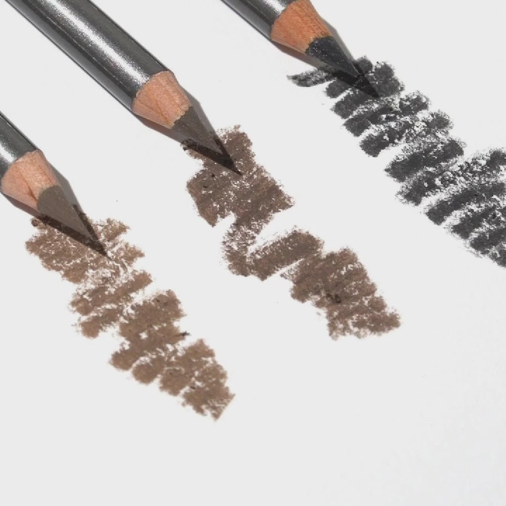 Detailed view of Brow Boost pencil with natural fiber bristles for volumizing and filling sparse eyebrows.